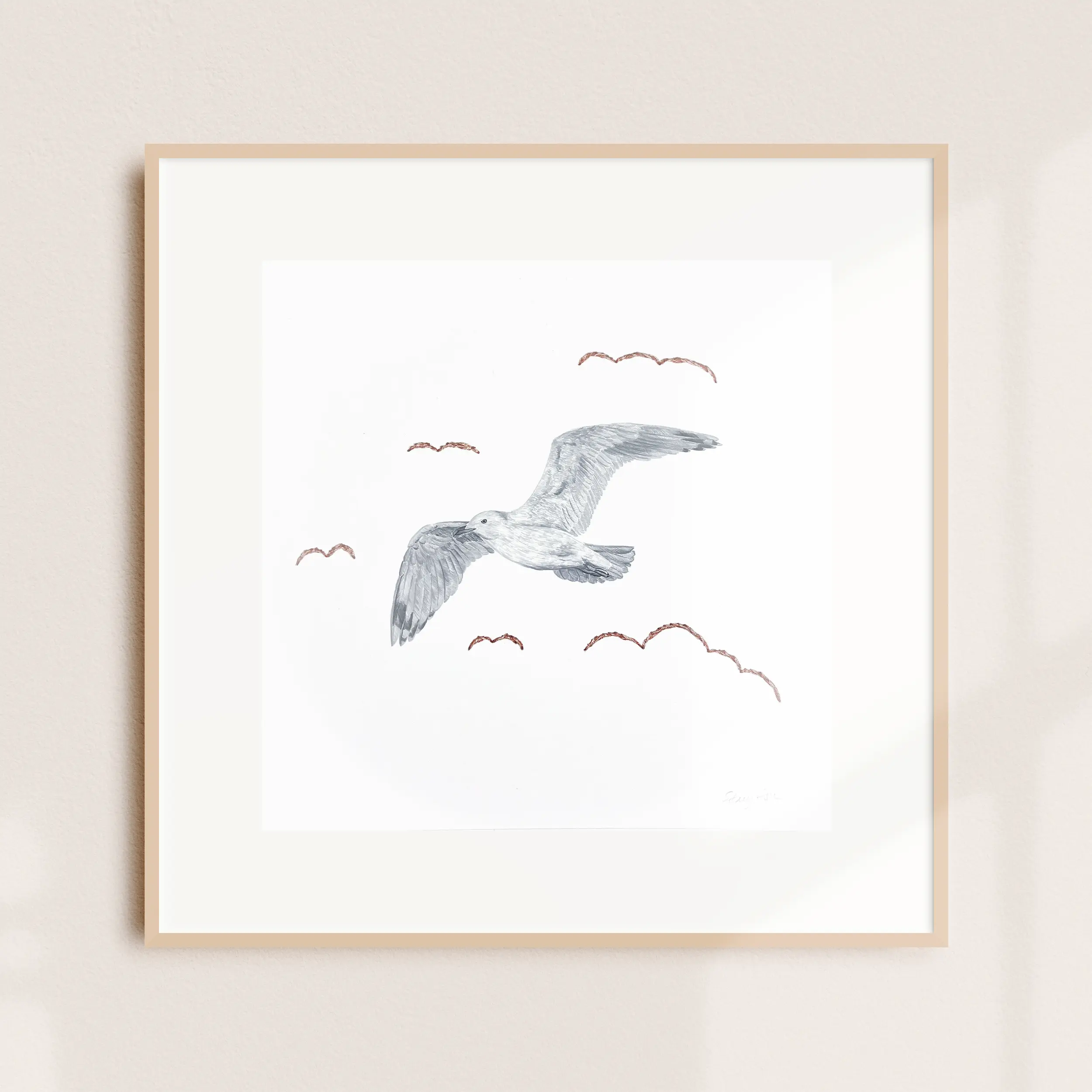A framed illustration of a seabird in flight