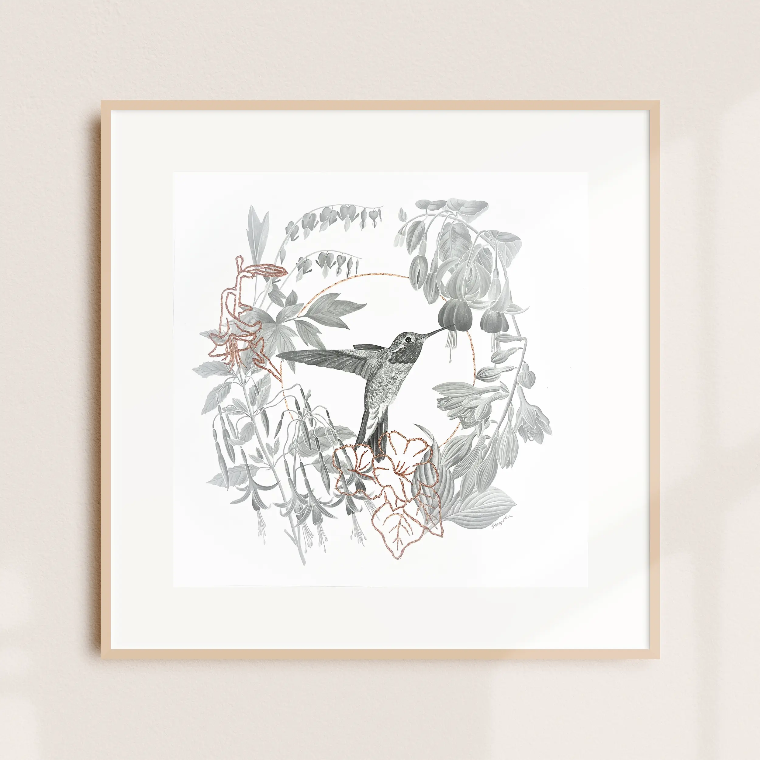 A framed illustration of a hummingbird