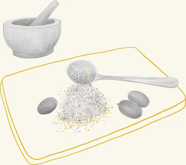 A mortar and pestle beside ground acorn meal