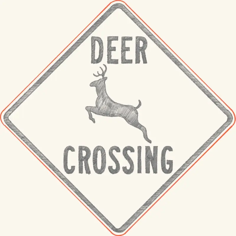 A deer crossing road sign