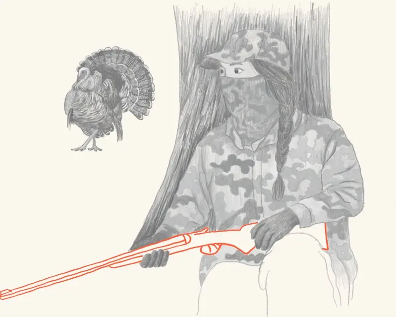 A hunter with a harvested wild turkey