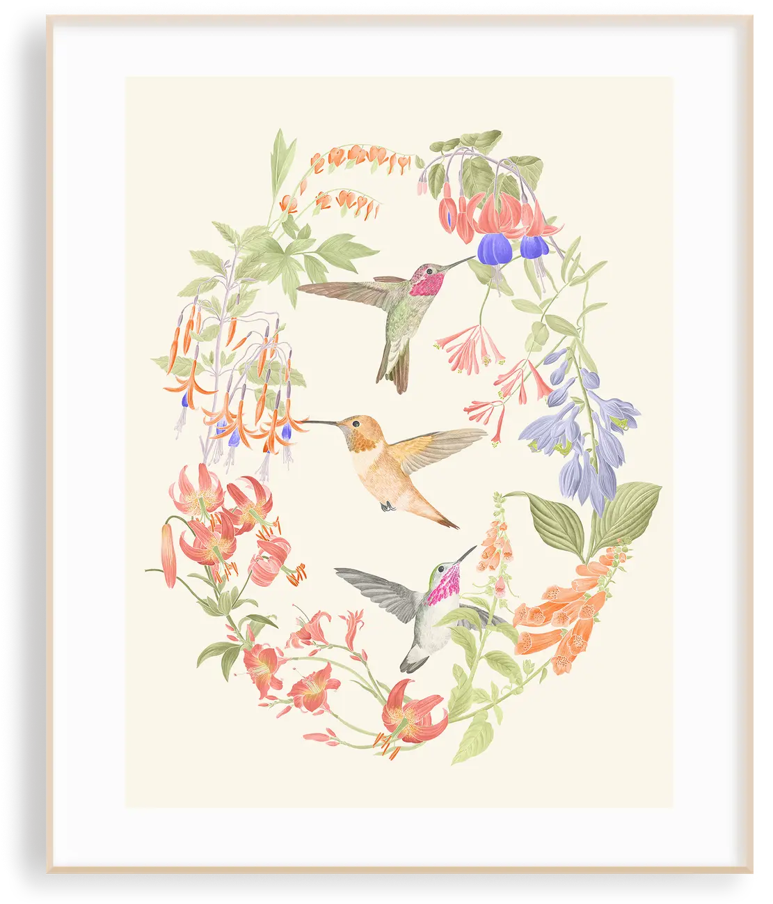 The Wings of Freedom hummingbirds print in a light wood frame — watercolour hummingbirds among fuchsias, tiger lilies, hostas, and bleeding hearts