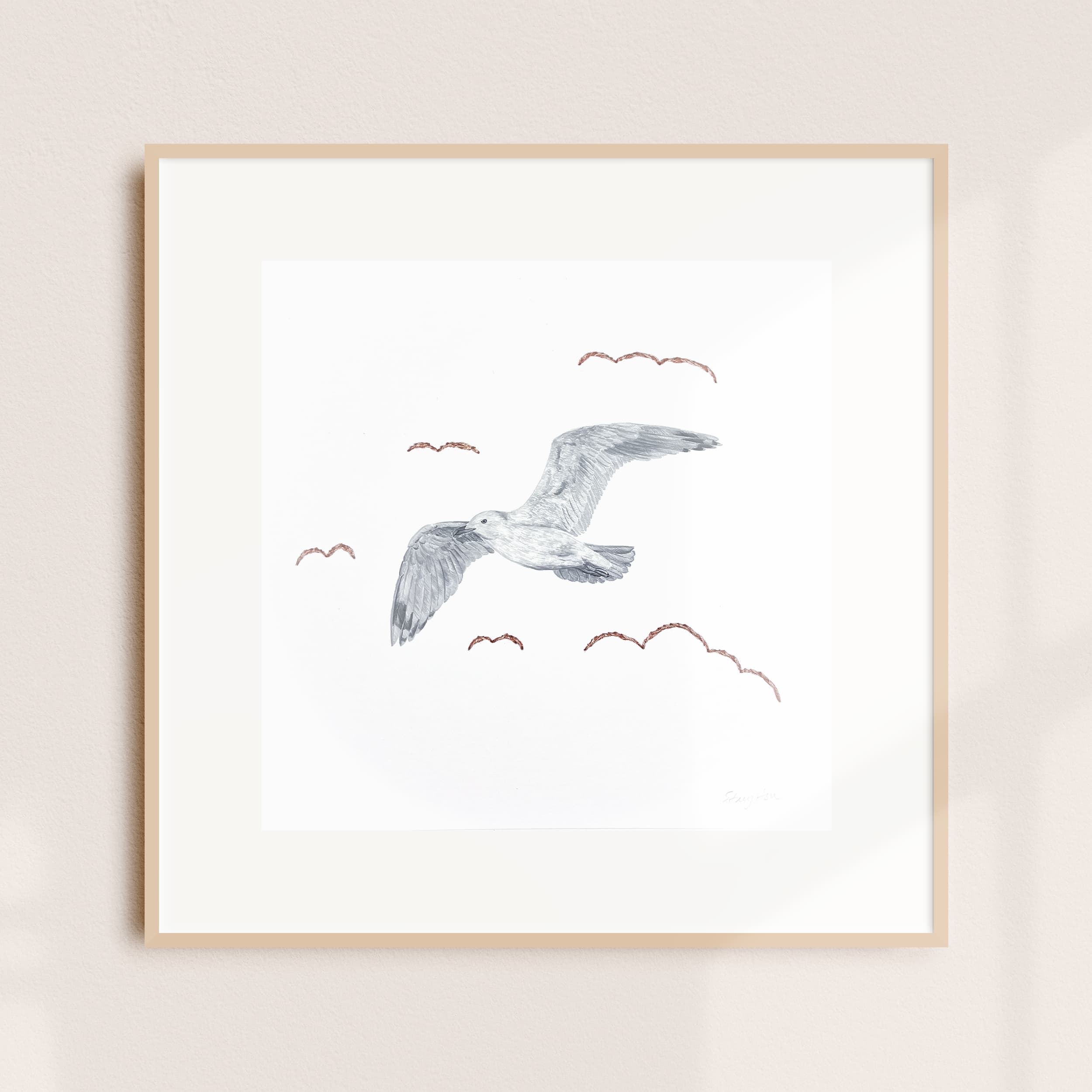 A framed illustration of a seabird in flight
