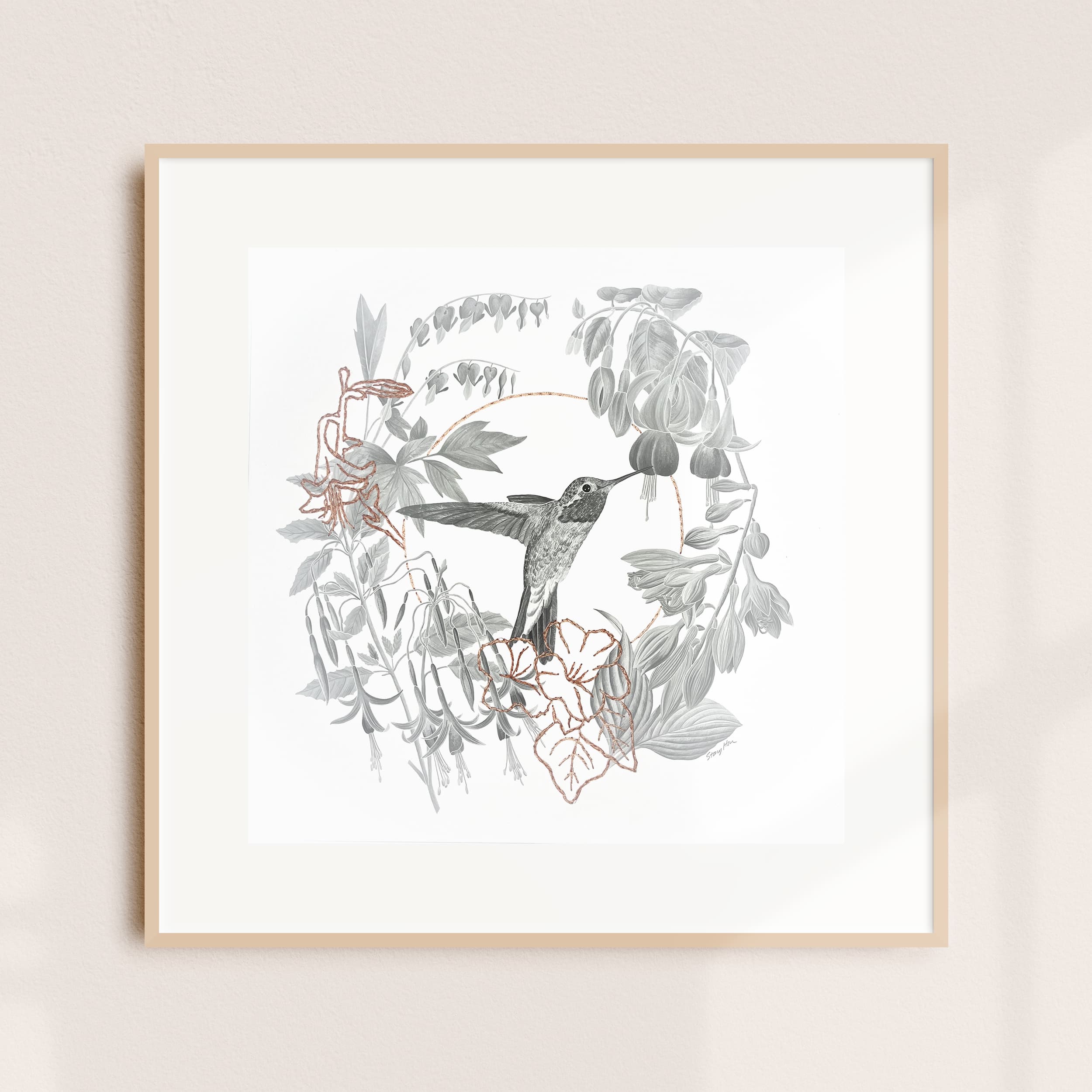 A framed illustration of a hummingbird