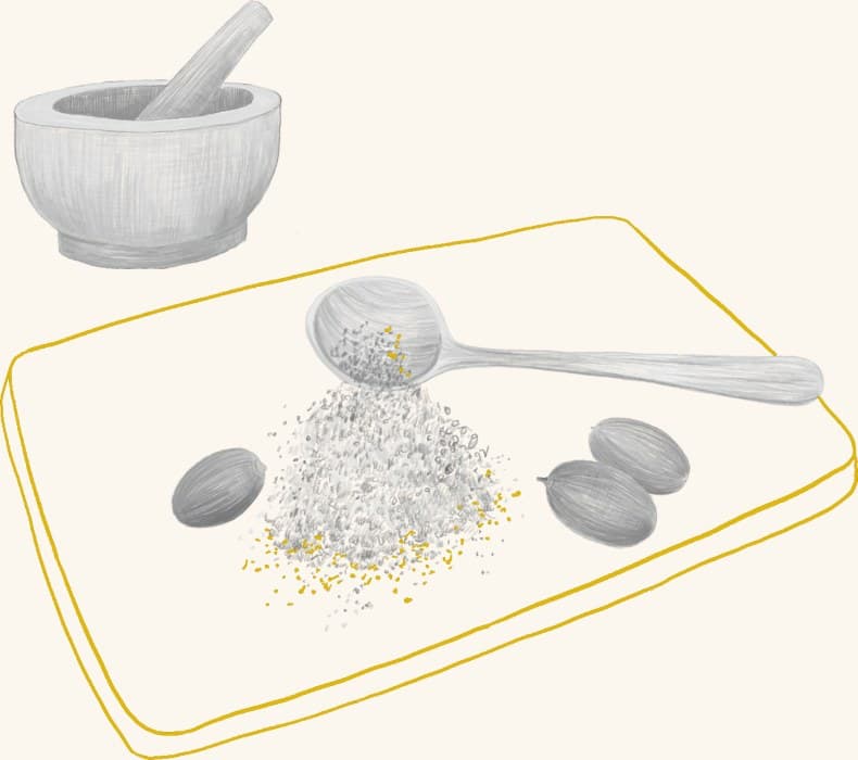 A mortar and pestle beside ground acorn meal