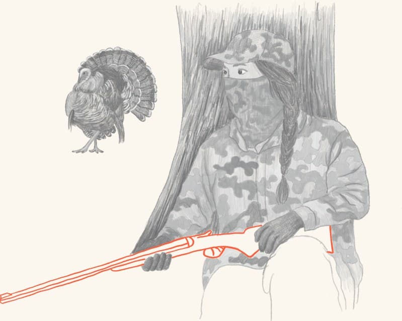 A hunter with a harvested wild turkey